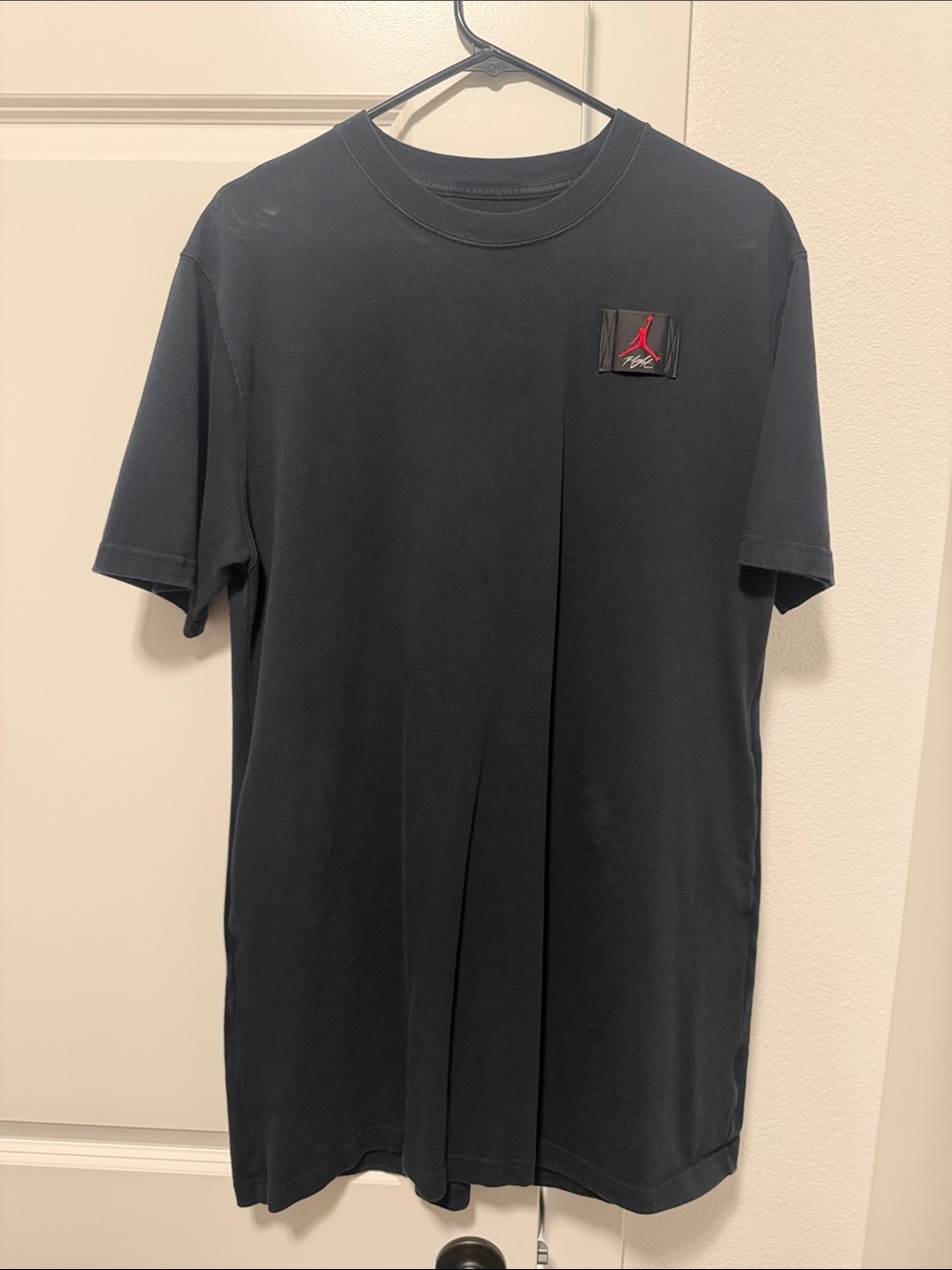 Nike Jordan Black Short-Sleeve T-Shirt with Red Jumpman Patch with Pockets